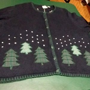 Women's black sweater with pine trees.